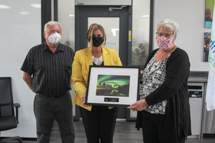 Trustee Garry Kissel and Board Chair Arlene Hrynyk present Tina Luciak with a 2020 Friends of Education Award.